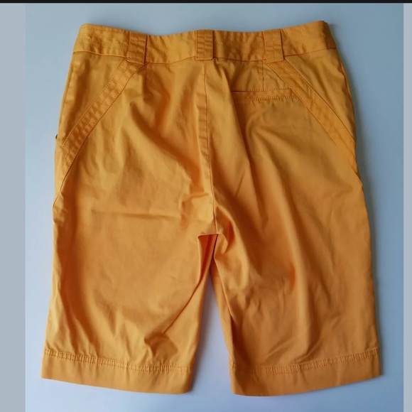 Annika Cutter and Buck Woman’s Orange Golf Shorts - Picture 2 of 7